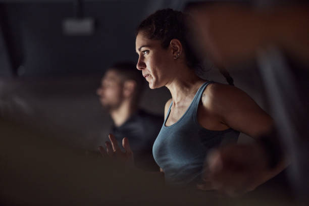 istock Athletic woman warming up in a gym. 2195418905