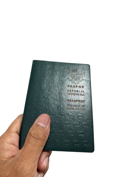 istock A hand holding an Indonesian passport 2195420093