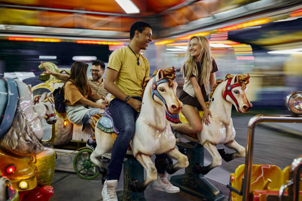 istock Fun on merry-go-round carousel ride in blurred motion! 2195420526