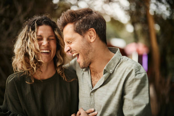 istock Cheerful couple laughing in nature. 2195420629