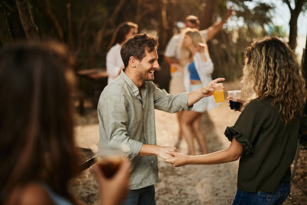 istock Happy couple dancing during spring party in nature. 2195421258