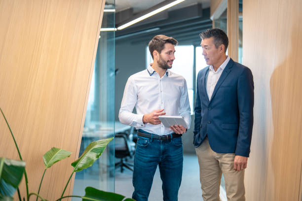 istock Collaborative Business Discussion in Modern Office 2195421353