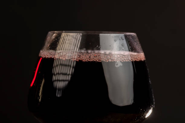 istock glass transparent glass with red juice 2195421518