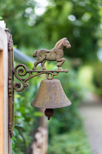 istock Rustic bell with horse ornament outdoors 2195426462