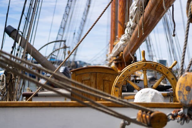 istock Wooden ship wheel and rigging details 2195426609