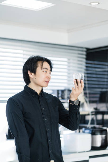 istock Asian young male white-collar workers enjoy black coffee at home 2195427379