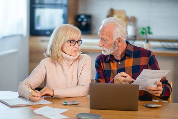istock Worried seniors calculating household budget 2195428337