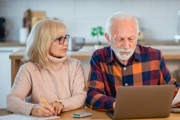 istock Worried seniors calculating household budget 2195429043