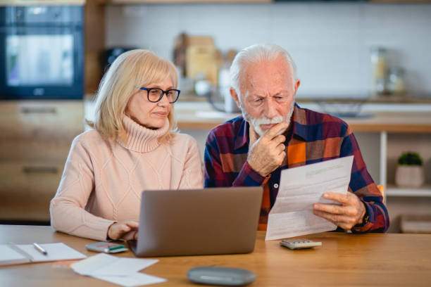 istock Worried seniors calculating household budget 2195429144