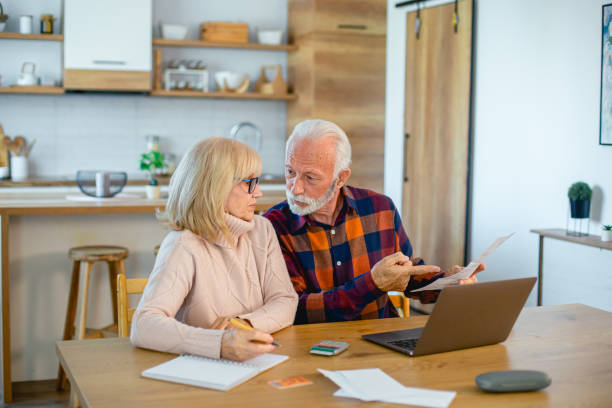 istock Worried seniors calculating household budget 2195429263
