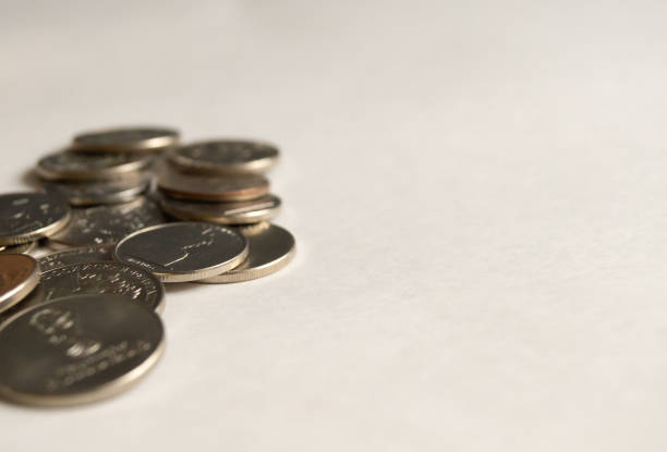 Coins and banknotes lying on the wooden floor