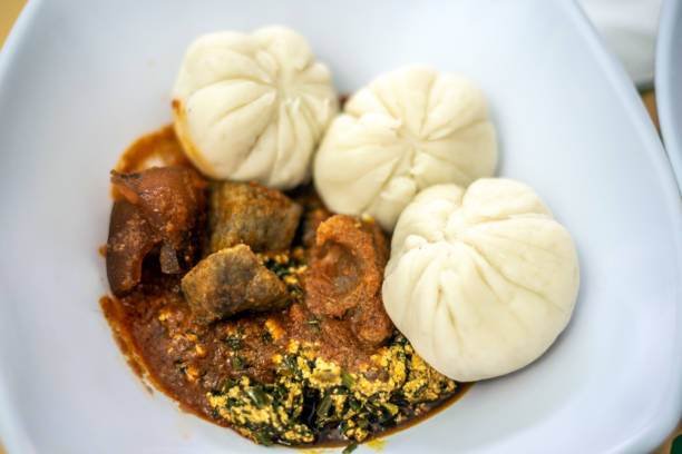 istock Pounded yam, Vegetable soup and stew with liver and pommo 2195435155