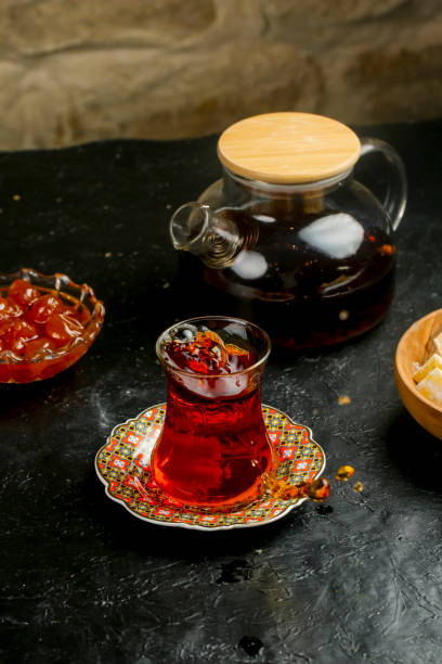 istock Traditional tea served in a decorative glass with sweets on a table 2195435977