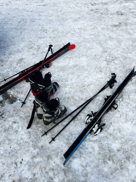 istock Skiing equipment resting on snowy ground on a cold winter day 2195436163
