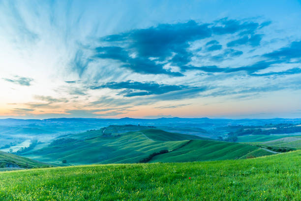 istock Dawn in a rolling Italian countryside landscape 2195436449