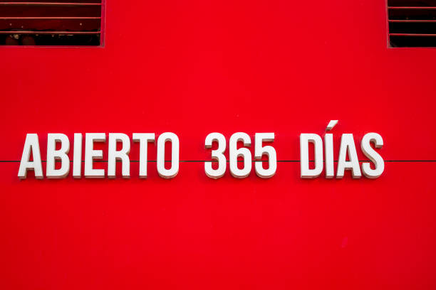 Malaga, Spain, 29 December 2024 a Spanish text informing about business being 'open 365 days' - white letters on red background