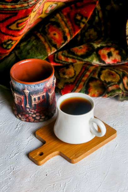 istock Traditional coffee served in unique cups on a decorative tablecloth 2195436646