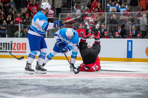 istock Professional Ice Hockey Players Collide During Intense Game Action 2195438719