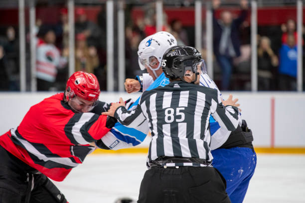 istock Intense Ice Hockey Fight Between Rival Players on Rink 2195438722