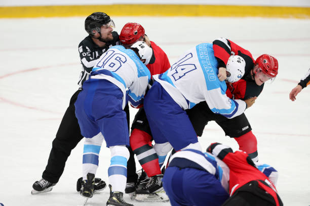 istock Professional Ice Hockey Players Clash During Intense Game Fight 2195438783