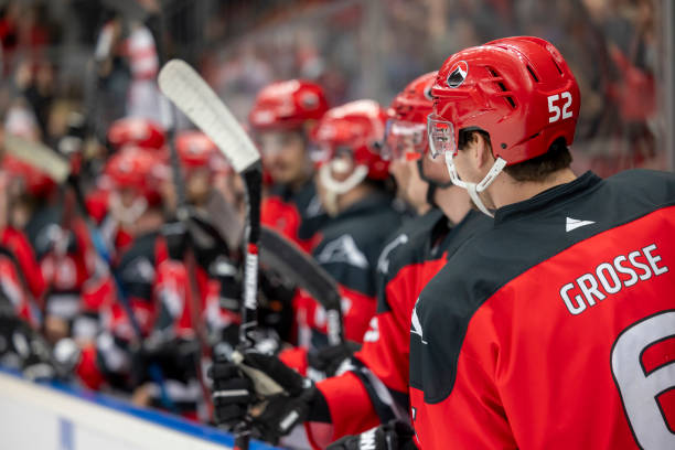 istock Ice Hockey Players Watching Game From Bench 2195439341