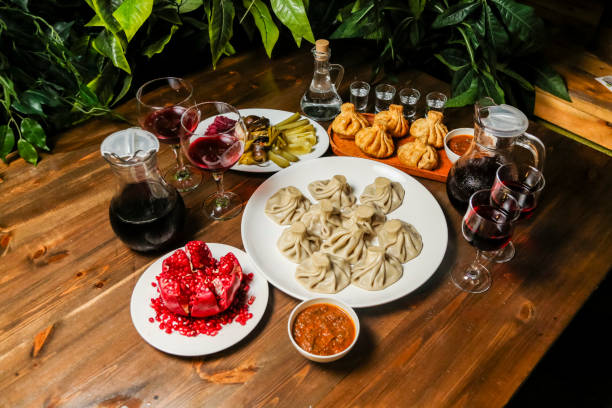 istock Delicious Georgian feast featuring khinkali and various drinks 2195440499