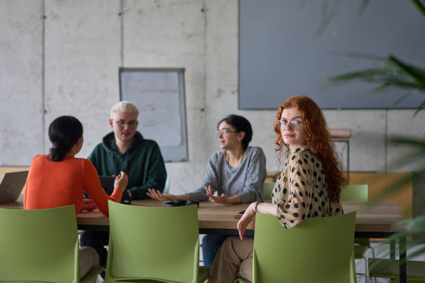 istock A young, diverse business team sitting together in a modern office, exchanging ideas and business plans, fostering collaboration and innovation for future success. 2195441079