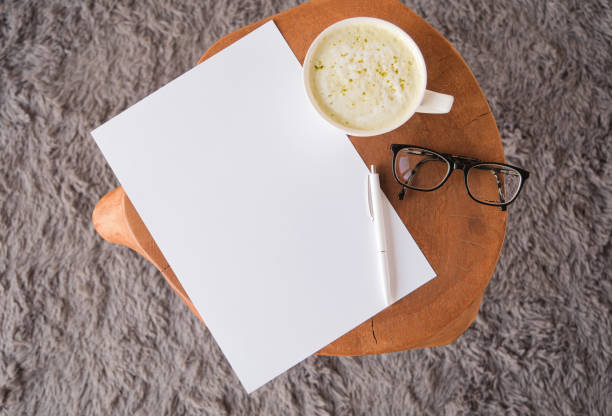 istock blank paper sheet mockup on coffee table with green matcha tea 2195441449