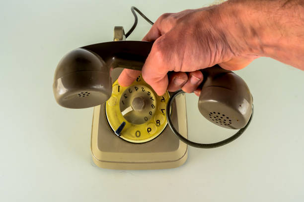 istock A hand is holding a phone with a dial pad 2195441508