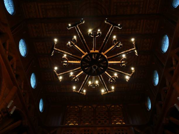 istock Ornate chandelier in a dimly lit interior. 2195441582