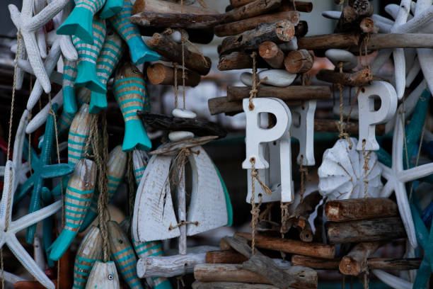 Coastal themed decorations with driftwood, fish, and starfish motifs