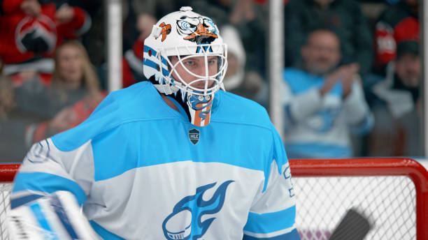 istock Determined Ice Hockey Goalie in Action 2195443276