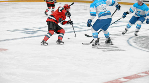 istock Intense Ice Hockey Match with Skillful Players 2195443304