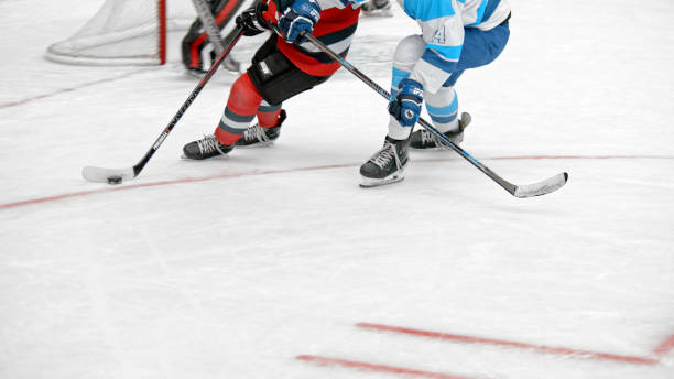 istock Intense Ice Hockey Battle with Skates in Action 2195443314