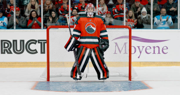 istock Determined Caucasian Ice Hockey Goalie Guards the Net 2195443898