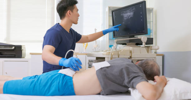 istock asian Doctor Scans Lower Back 2195444424