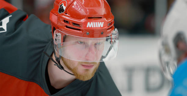 istock Focused Caucasian Ice Hockey Player Ready for Face Off 2195444690