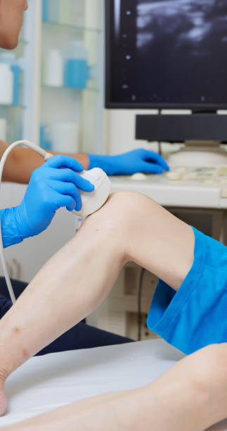 istock asia Doctor Perform Knee Ultrasound 2195444925