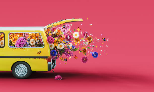 istock Yellow van full of colorful spring flowers on pink background with copy space. Spring is here concept design. 2195445603
