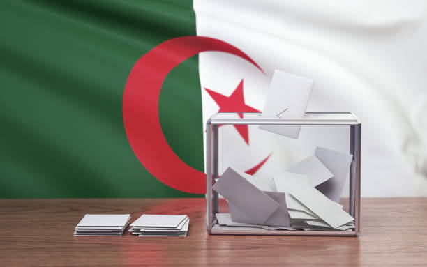 istock Plexiglass with Metallic Edges and National Flag Behind for Algeria Elections 2195446847