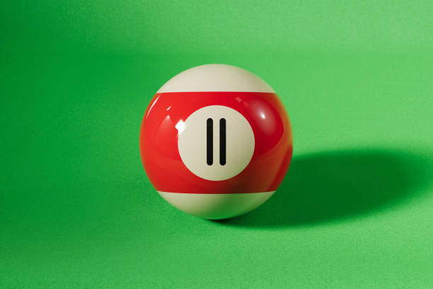 Isolated Striking Red Striped Billiard Ball Number Seven
