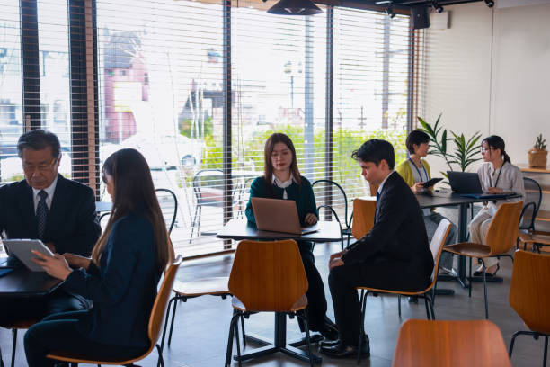 istock Wide Shot Of People Work In A Modern Office 2195449019