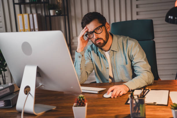istock Young businessman feeling stressed while working at home office in casual style indoors 2195452672