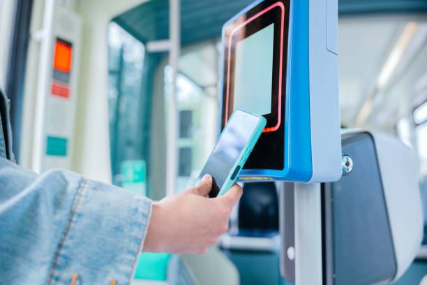istock Contactless Payment with Smartphone on Public Transport Validator 2195453116