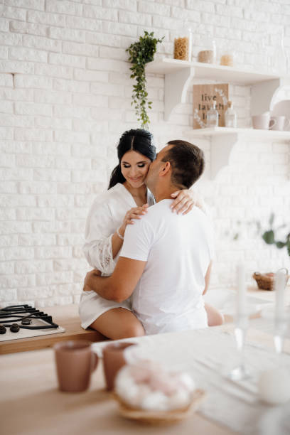istock young couple guy and girl in a large kitchen 2195454210