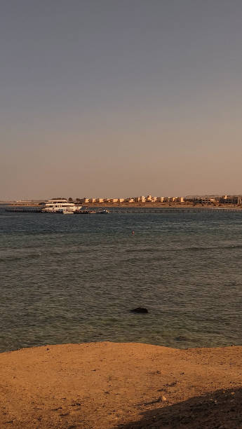 istock Calm red sea waters lapping against sandy shore in marsa alam, egypt 2195458328