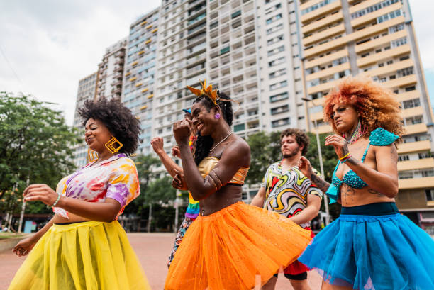 istock Friends dancing at the street carnival 2195460668