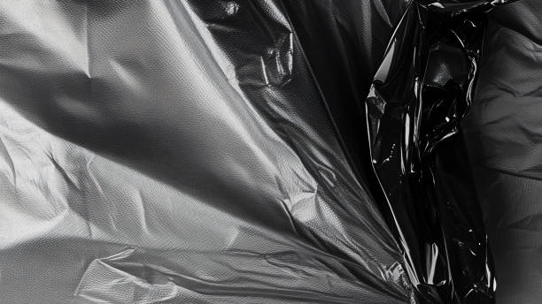 istock Black transparent plastic wrap texture overlay background. Realistic plastic for poster design and photo overlay effect. Wrinkled plastic surface pattern for graphic design sources and element mockup. 2195461265