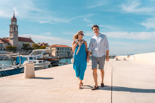 istock Mature Caucasian Couple Strolling Adriatic Coast 2195461460