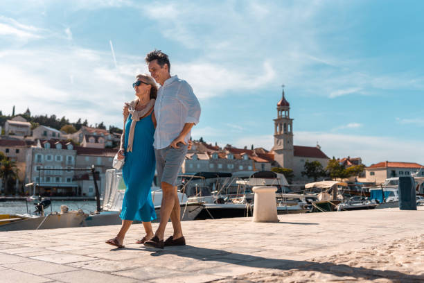 istock Mature Caucasian Couple Strolling Coastal Sutivan 2195461462